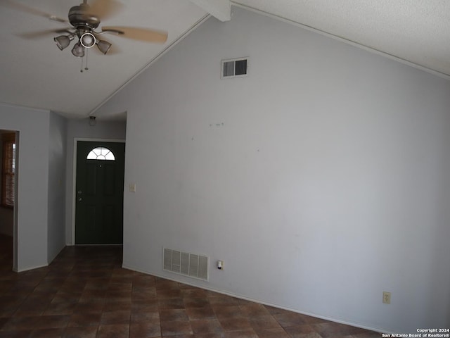 entrance foyer featuring lofted ceiling with beams and ceiling fan