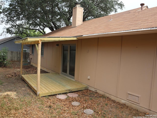 12047 Stoney Brg, San Antonio, TX 78247 - back of property with a chimney, fence, and a deck