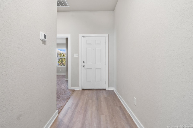 hallway with light wood-type flooring