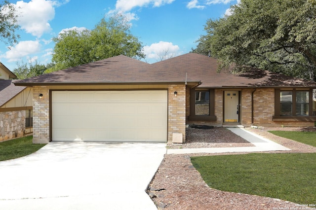 single story home featuring a garage