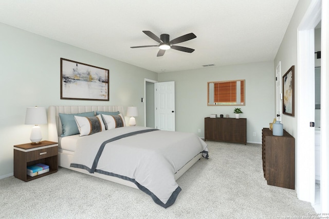 bedroom featuring ceiling fan and light carpet