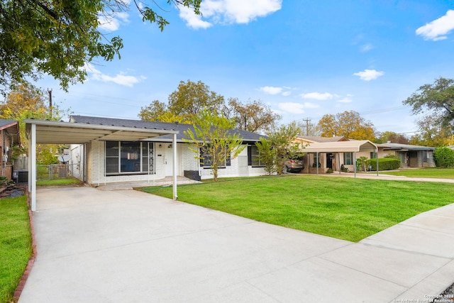 ranch-style house with central air condition unit, a front yard, and a carport