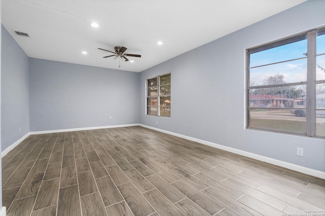 empty room featuring ceiling fan and wood-type flooring