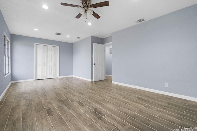 interior space with hardwood / wood-style floors and ceiling fan