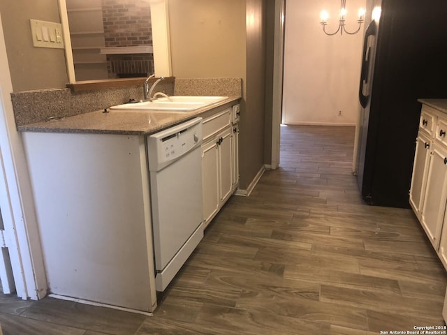 kitchen with dishwasher, sink, dark hardwood / wood-style floors, fridge, and white cabinets