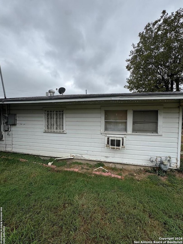 view of home's exterior featuring a yard