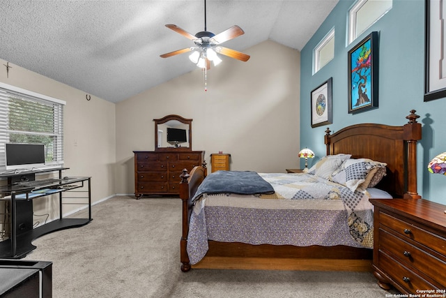 bedroom with a textured ceiling, ceiling fan, light carpet, and lofted ceiling