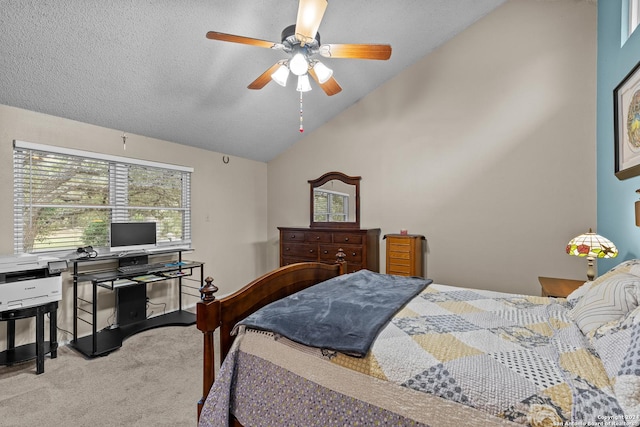 carpeted bedroom with a textured ceiling, vaulted ceiling, and ceiling fan