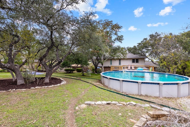 view of pool featuring a yard