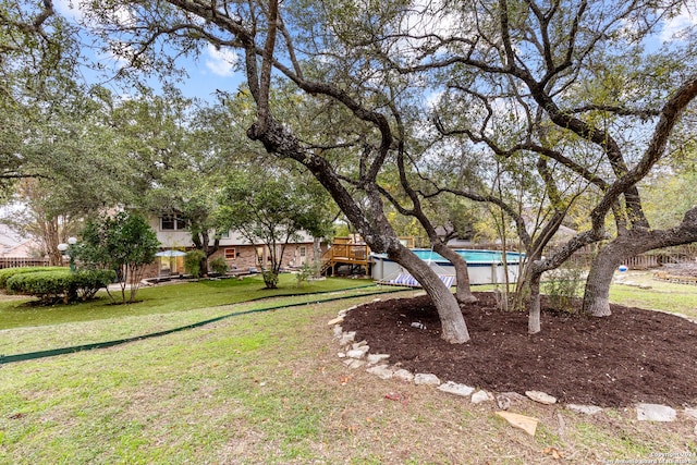 view of yard featuring a fenced in pool