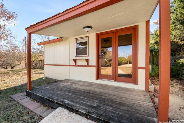 property entrance with a deck