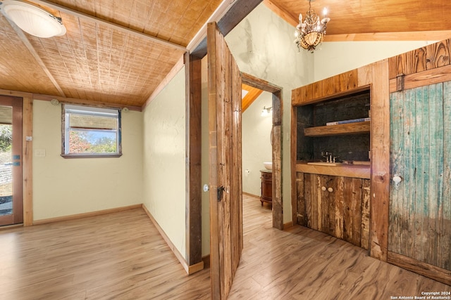 hall featuring a notable chandelier, wood-type flooring, wood ceiling, and vaulted ceiling