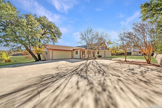 ranch-style home featuring a garage