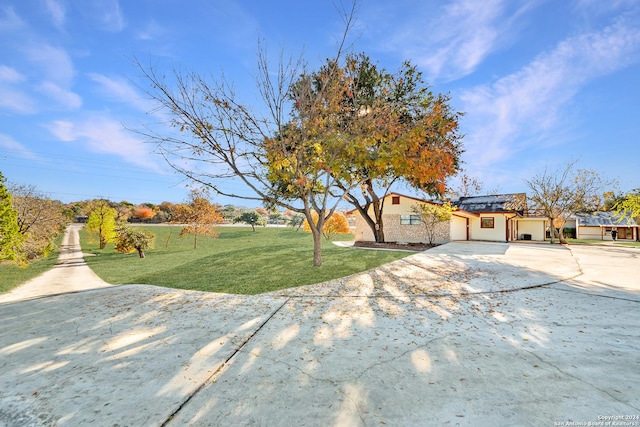 view of front of home with a garage and a front yard