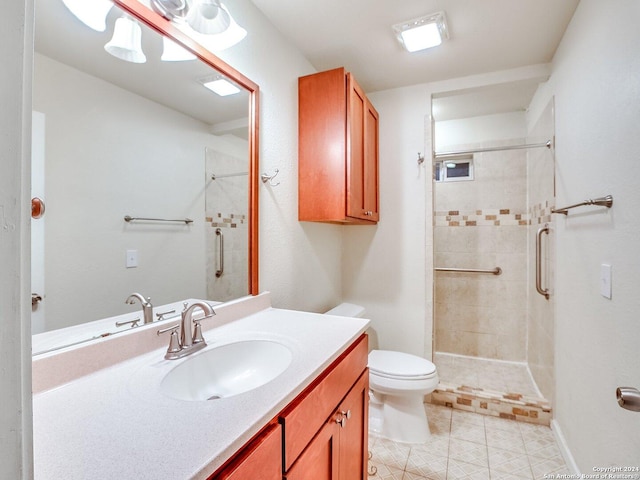 bathroom featuring tile patterned floors, vanity, toilet, and an enclosed shower