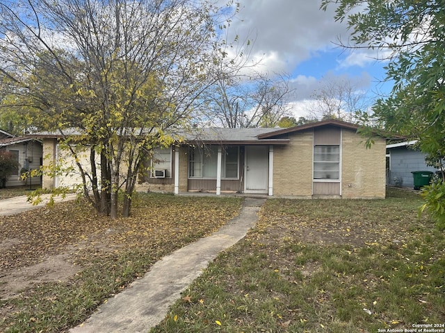 ranch-style home with cooling unit