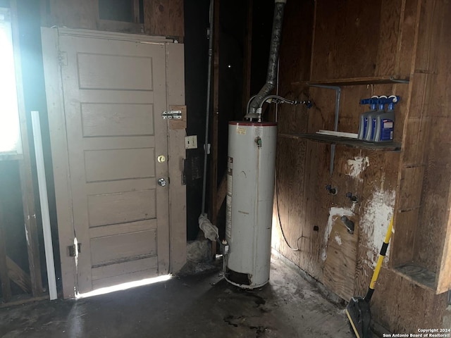 utility room featuring water heater