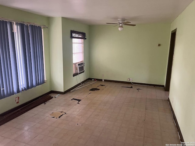 empty room with ceiling fan and cooling unit