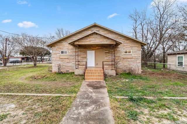 1206 W Hein Rd, San Antonio, TX 78220 - bungalow-style home featuring a front lawn, fence, and stone siding