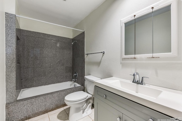 full bathroom with vanity, tiled shower / bath combo, tile patterned floors, and toilet