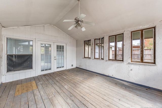 interior space featuring french doors, ceiling fan, plenty of natural light, and vaulted ceiling