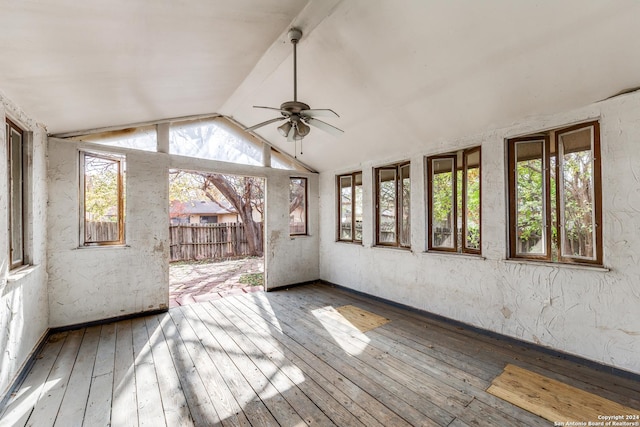 unfurnished sunroom with vaulted ceiling with beams and ceiling fan