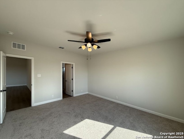 unfurnished bedroom with ceiling fan and carpet floors