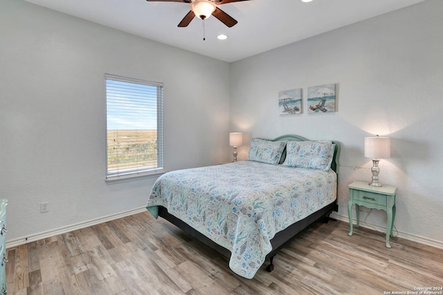 bedroom featuring ceiling fan and wood-type flooring