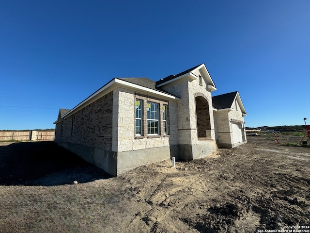 view of home's exterior featuring a garage