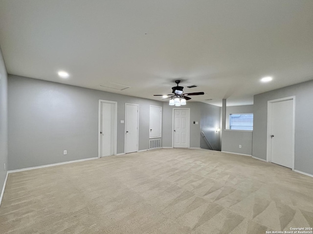 carpeted empty room featuring ceiling fan