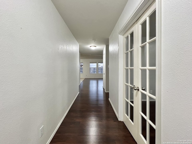 corridor with dark wood-type flooring