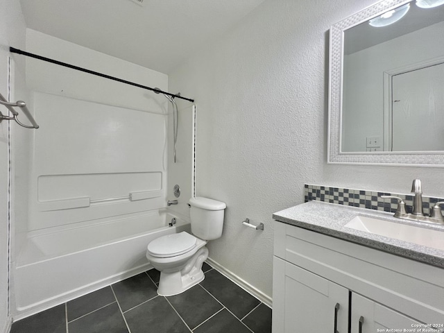 full bathroom with tile patterned flooring, vanity,  shower combination, and toilet