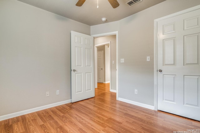 unfurnished bedroom featuring ceiling fan and light hardwood / wood-style floors