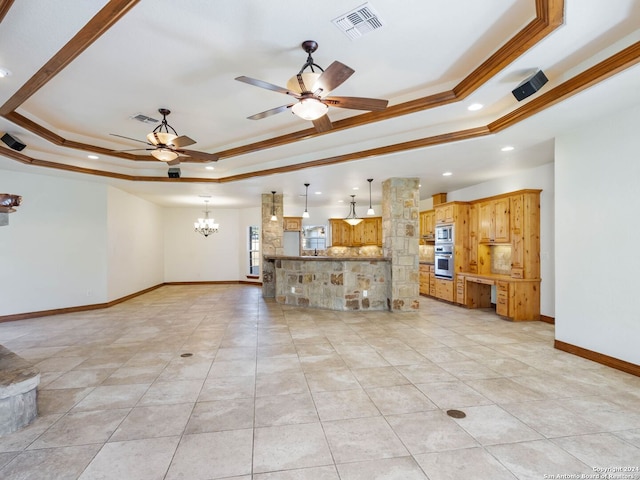 unfurnished living room with ceiling fan with notable chandelier, a raised ceiling, light tile patterned floors, and crown molding