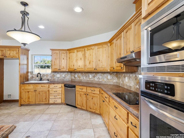 kitchen featuring sink, decorative light fixtures, decorative backsplash, light tile patterned floors, and appliances with stainless steel finishes