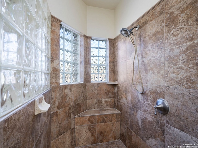 bathroom featuring a tile shower