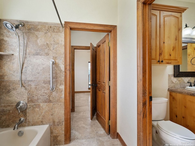 full bathroom featuring vanity, tile patterned floors, toilet, tile walls, and shower / bath combination