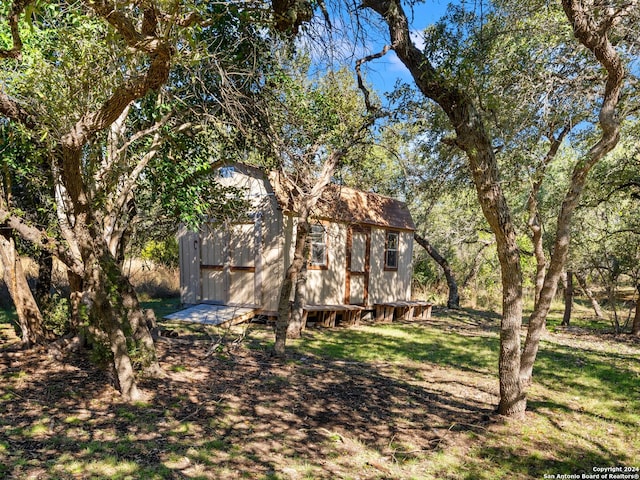 exterior space with a shed