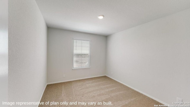 empty room featuring carpet flooring