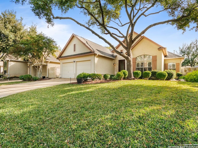 view of front of property featuring a garage and a front lawn