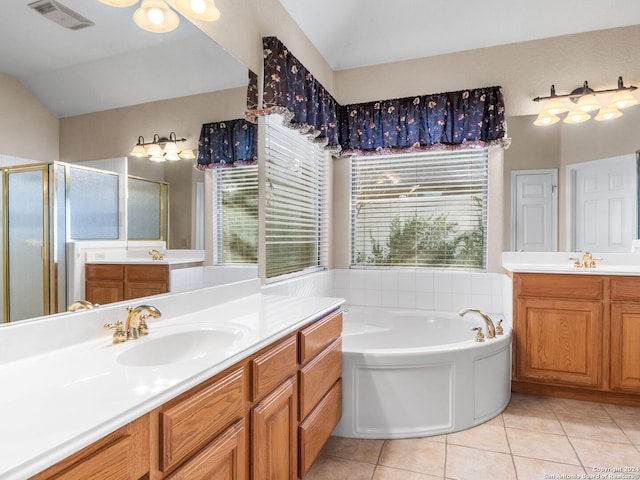 bathroom featuring tile patterned flooring, vanity, vaulted ceiling, and independent shower and bath