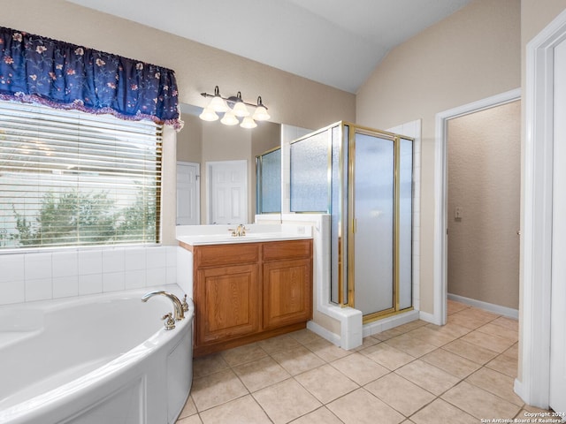 bathroom with tile patterned flooring, vanity, lofted ceiling, and shower with separate bathtub