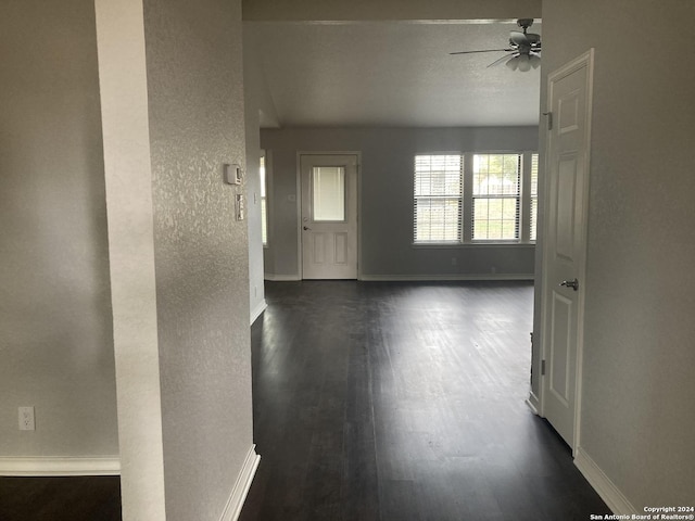 spare room with ceiling fan and dark hardwood / wood-style floors