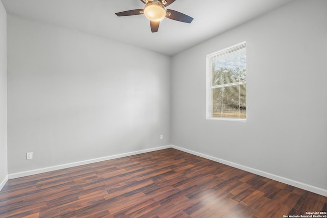 unfurnished room featuring ceiling fan and dark hardwood / wood-style floors