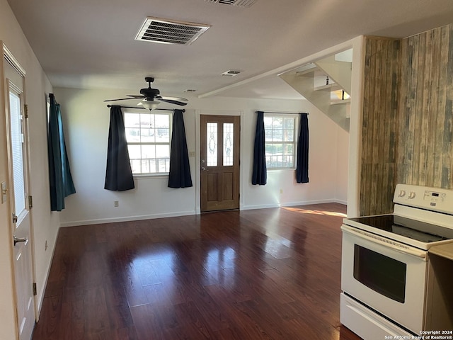 kitchen featuring white electric range oven, ceiling fan, and dark wood-type flooring