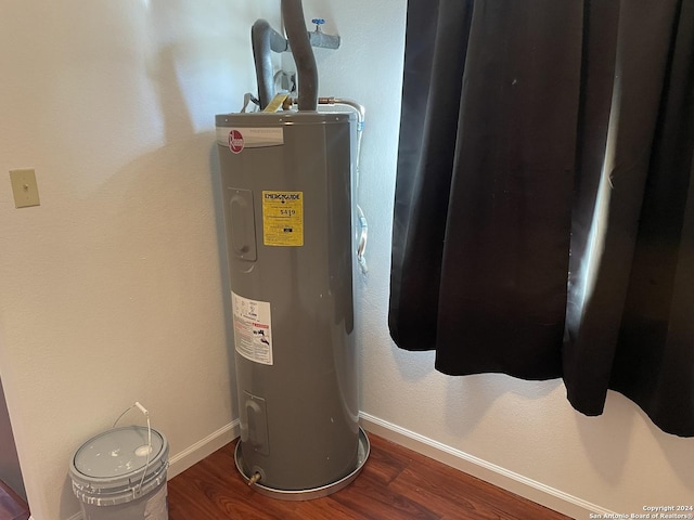 utility room featuring electric water heater