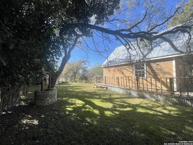 view of yard featuring a wooden deck