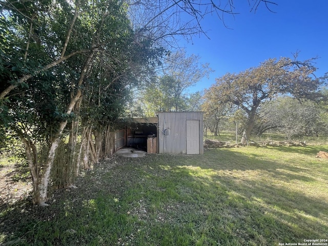 view of outdoor structure featuring a lawn