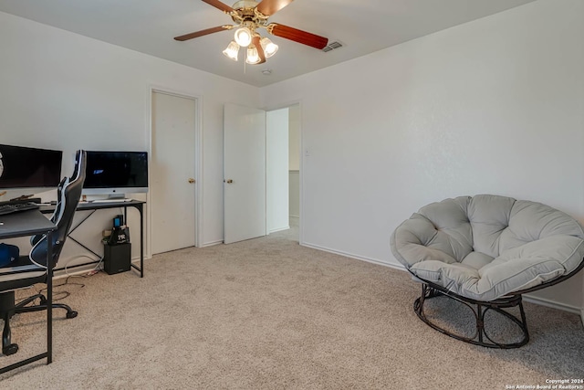 home office with ceiling fan and light colored carpet