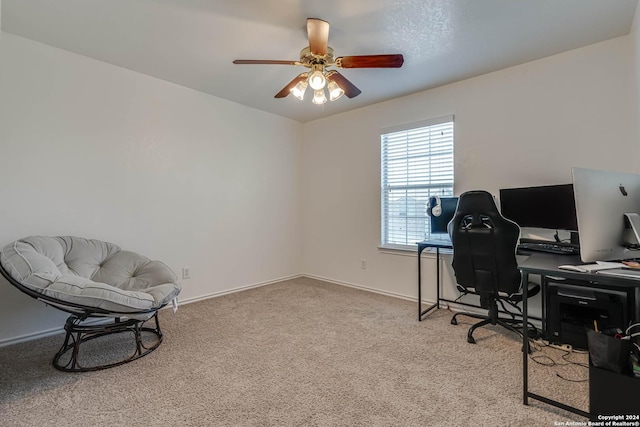 office space featuring ceiling fan and light colored carpet